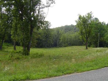 $117,500
Traphill, 16.1 +/- acres with spectacular building site.