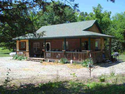 $124,900
1692R-This cozy, log sided home on 3 acres is located minutes to Pomme de Terre