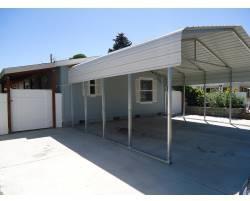 $125,000
Looking for a low maintenance yard with storage and extra parking?