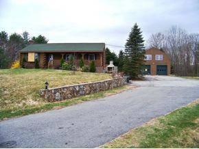 $146,900
East Kingston 3BR 1BA, Wonderful country log home that needs