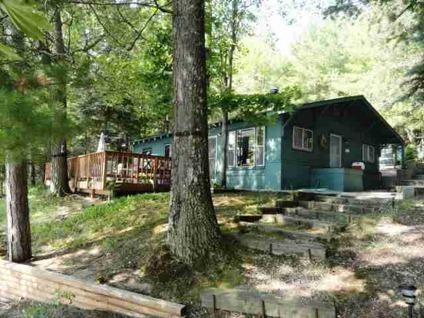 $185,000
Traverse City 2BR 1BA, Classic knotty pine cottage on scenic