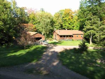 $209,000
Beautiful Log Home Nestled In 9 Wooded Acres