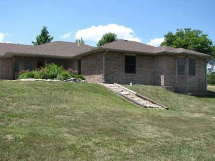 $215,000
This striking brick ranch is on 10.5 acres with great views of the countryside.
