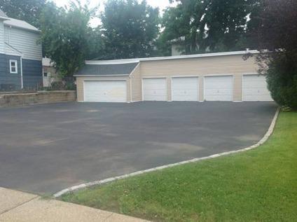 $350,000
Centrally located paved yard with garages near Westbury Village