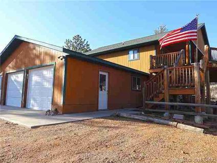 $375,000
Live in the pine trees backed up to National Forest in this Three BR