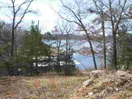 $43,000
overlooking peaceful cove. 1.28 acres M/L. Close to lake & dock area.