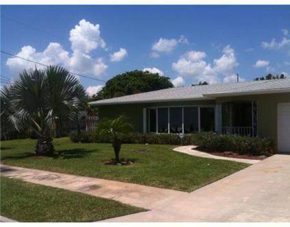 $450,000
Lake Worth Two BR Two BA, Pool Home with Water Frontage and Dock