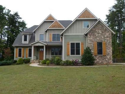 $505,000
Mooresville 4BR 4BA, Custom stone-accented home with views