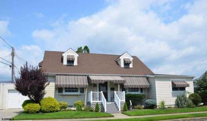 $525,000
This immaculate spacious Cape Cod located on the edge of the Parkway Section is