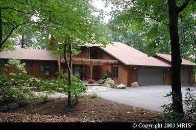 $549,900
Custom home nestled in the woods w/stream and pond on almost 9 acres!