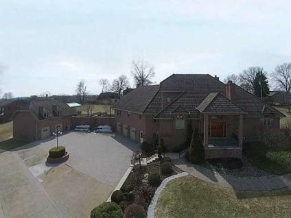 $599,900
Custom 2 acre estate home w/ detached carriage house and greenhouse.