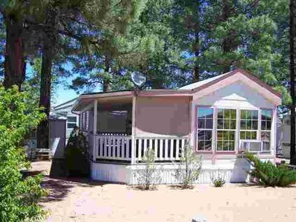$67,500
Overgaard, Tall Pines shade this Cavco Park Model with
