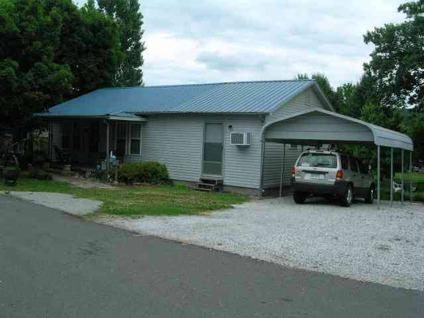 $69,900
Adorable Country Home in Town with Beautiful Landscaped Yard.