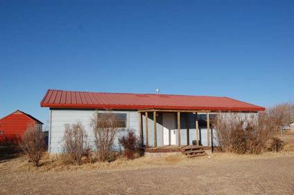$70,000
1 acre lot with Two BR home, a workshop and a storage building.