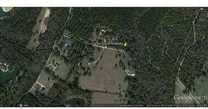 $75,000
Get Away! Private Road with nice homes surrounding this wooded 5 Acre parcel.
