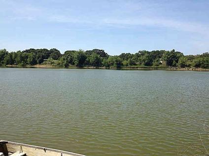 $800,000
Park like setting with mature oak trees, grape vines, 13 acre lake, 5 acre lake