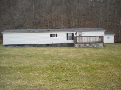 $80,000
1998 Holly Park Mobile Home w/ 13.5 acres and garage w/ outbuilding