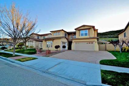 MOVE IN READY!! Lovely and spacious, this highly upgraded Five BR Dos Vientos