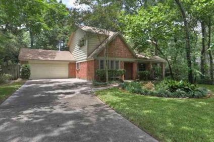 Remarkable Tudor styled home set in a wooded setting on a culdesac lot with huge