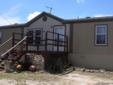 $89,900
Open Four BR Two BA manufactured home in Rebecca Creek. Open, bright kitchen.