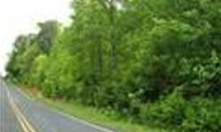 The parcel is about 1 mi. from Hwy. 11, the Cherokee Foothills Scenic Hwy., and Table Rock State Park. The heavily wooded lot has a gentle slope with a stream running through the middle. The parcel is in a rural setting surrounded by woods and farms. A