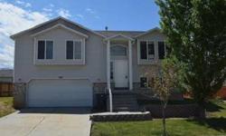 This home may qualify for the $100 FHA LOAN down payment program. Call listing agent for details. Great split entry home in Tooele. This home features a large kitchen and dining area with a sliding glass door that opens up to a deck, a large master
