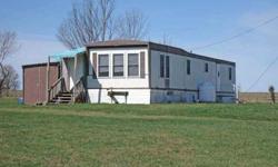 Barn and pond on 11+ acres with two rental trailers. Each trailer has 2 bedrooms, 1 bath, kitchen, living rooms and its own well/septic. Great space for a small farm with income. Barn has 200 amp electric with circuit breakers, septic and running water.