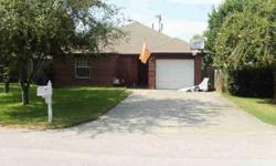 This brick home has a large double lot that is totaly fenced with double gate access. The interior is very open sith cermaic tile in main living and dining/kitchen area. The master bdrm is split off the main area with ist on full bath and walk-in