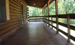 WONDERFUL SETTING and location comes with this 2 BR log cabin in Patronville.Great condition, open floor plan, porch, covered patio, and detached 36x24 outbuilding. A must see!Listing originally posted at http