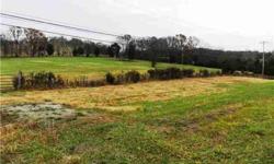 REDUCED $26,715! 6.85 Ac/ N side of Bear Cr. Pk. 610 ft Rd Fr Appr. Public utilities avl. Wonderful Home site, sitting on knoll with gentle roll to it. Locaction could not be better for N/S Commuter. Imm. Occ. Bring Builder, then Bring contracts