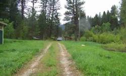 2 Lots for the price of ONE! Beautiful lots bordering Clear Creek with water rights. Beautiful views, wildlife, sounds of the creek are perfect for your new home/cabin or for your escape from city life. Large, newer shop and mobile home included in sale.