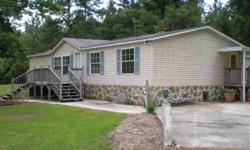 Quiet country living can be yours with this cute 3 bedroom, 2 bath home with beautiful stone skirting on 5.05 ACRES of land ~ close enough to town, but just far enough away to feel like you are out in the country ~ this property offers lots of trees, and