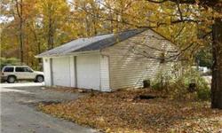 Two lots give you a beautiful place to build your home. Has many tall trees and mature evergreens, even a beautiful dogwood. Lot is open and wooded. Was a mobile home but has been removed so has a well and septic. Also has a nice garage. This subdivision