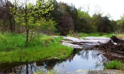 HARD TO FIND IN JOHNSTON COUNTY,OK. A SCENIC 40 ACRES, A PERFECT place for PEACE and QUIET! Sandy Creek is at the back of the property, AMAZING rock outcroppings,when the creek is running water falls can make it even more picturesque,the land is partially