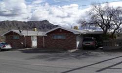 Enjoy morning coffee on the covered patio enjoying views of the Rio Grande & Turtleback Mtn. Owners quarters are 2 or 3 bedrooms, 2 baths, fireplace & covered parking. Apartment is 1 bedroom, 1 bath; separate driveways. Gas & electric metered separately.