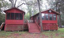 Affordable Suwannee River property now available! This 1.71 acres with 2 bed/1 bath rustic cottage is a great get-a-way!Cottage has full kitchen w/refrigerator & range/oven. Enjoy features like fireplace, screened porch, large deck and picnic shelter on