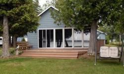 Gulliver Lake Cottage - west facing, 2 bedroom, 1 bath with fireplace in living room and large sun room overlooking lake. Lots of closet space and a 14' x 20' garage for additional storage. Well maintained and ready to enjoy! 60' dock, appliances and most