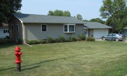Enjoy the small town Iowa feeling from the covered patio of this wonderful 2 b/r raised ranch home. The home features an open floor plan, newer vinyl siding, main floor laundry, beautiful bay window off the living room, and is located on more than a