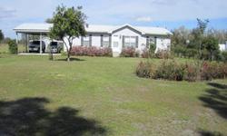Beautiful 3 bedroom 2 bathroom 2 car carport home on 2 acres of cleared land on the Kissimmee Chain of Lakes. Home features updated kitchen with wood cabinets travertine tile countertops and backsplash, newer appliances which include gas cooktop stove,