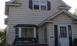 Mint condition turn key rental opportunity. Newly relicensed. Rented thru 5/13 /2013 - $1200/month. Tenants pay all electric and garbage. Owners pay heat, water, sewer. Nicely maintained. Carpet over hardwood floors on main floor. Main floor laundry with