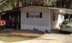 Real Nice 2 bedroom 1 bath single wide mobile home, with all aluminum wheel chair ramp, covered screen porch and a carport. Size 14x60 Very nice quiet community. Centrally located close to the mall in Crystal River. SELL PRICE;;; $10,700.00 OR OBO Comes