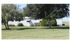 PASTORAL PERFECTION AND PRIVACY! This 2 bedroom 2 bath mobile home is located in Auburndale close to the new UFS campus. This meticulously maintained home sits on a corner lot on one acre. The workshop is perfect for working on hobbies or storage. The