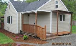 2 bed, 2 bath, 870 sq ft rambler on .36 acre lot. This must see starter home in Puyallup Valley has more room than you would think. Features an updated kitchen, separate dining area, living room with free standing gas fireplace, and Master with private