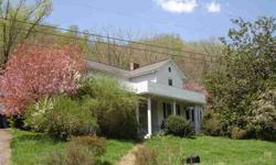 Potential!! Character!! Location!! This 1912 farmhouse is waiting for you to make it your special home. Restore or renovate this home which features high ceilings, wood floors, country covered porch, bead board walls, spacious rooms, garden area, flower