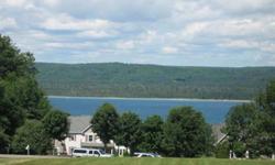 Spacious building site with Lake Charlevoix views. Property is in Blue Water Ridge Association surrounded by newer homes. Enjoy 100 ft. of private Lake Charlevoix frontage. Start planning your new Lake Charlevoix home now!Listing originally posted at http