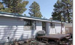 Looking for an affordable and well maintained home? Look no further, 3 bedroom, 2 bath manufactured home featuring 1,440 sq. ft., vaulted ceilings, split floor plan and a huge laundry room. Other upgrades include a metal roof, quonset style garage, stone