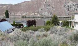 One of the best remaining vacant lots in Lake Entiat Estates/Sun Cove. Borders Lakefront Drive & Beach Drive, right next to the front row with awesome views of the river. The lot is suitable for any style of home but ideal for a daylight basement rambler