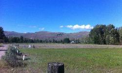 Horse Lovers, Come Running! Beautiful, newly created 5 acre parcel with two fenced pastures and a large pole structure with concrete floor. Great location ? private and serene ? off quiet Beaver Pond Road, south of Twisp. Lovely views, usable flat ground,