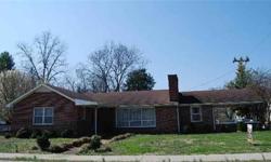 This brick ranch is in town and well located on a corner lot. It has hardwood floors, fireplace that opens to the den and living room, basement with concrete floor for storage or safety area.Listing originally posted at http