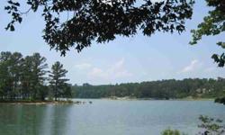 Gentle slopping lake lot on year round water (Dismal Creek). Wooded, private, paved road, building restrictions are 2100 sq. ft. w/min of 1200 sq. ft. on 1st level. HOA fees are $150.00 per yer per lot. Architectural Review Board. This lot is located in